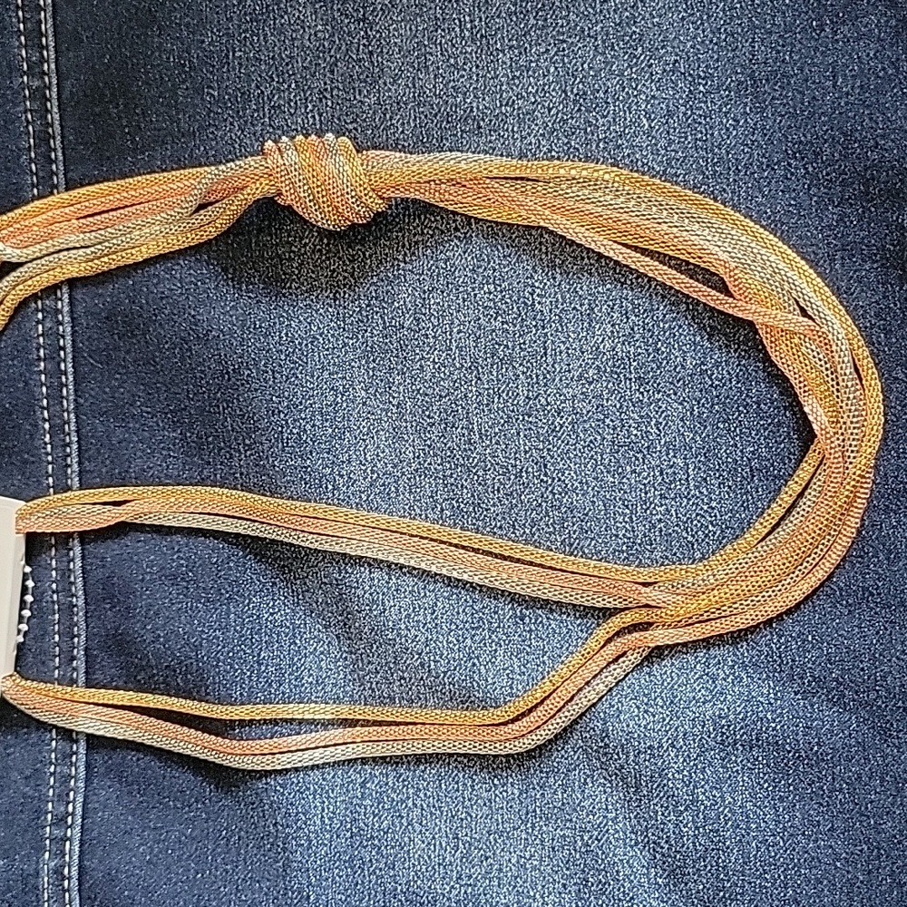 Tricolor gold, rose gold and silver hanging necklace.